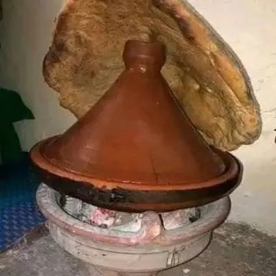 a brown bell sitting on top of a toilet at Gite ditabe tafoukte