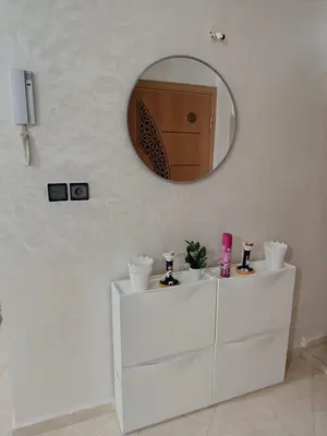 a mirror on top of a dresser in a bathroom at Dar ARAHA in Fès