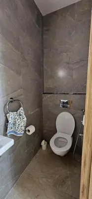 a bathroom with a toilet and a sink at Agadir bay in Oulad Akkou