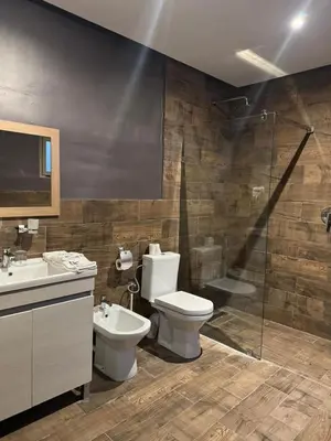 a bathroom with a toilet and a shower and a sink at RS Hôtel Karam Resort in Ouarzazate