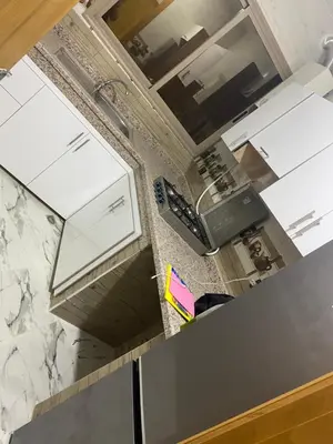 an overhead view of a kitchen with white cabinets at Al basatine in Meknès