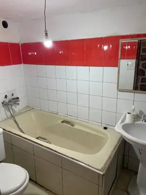 a bathroom with a tub and a toilet and a sink at Boulemane guest house in Boulmane