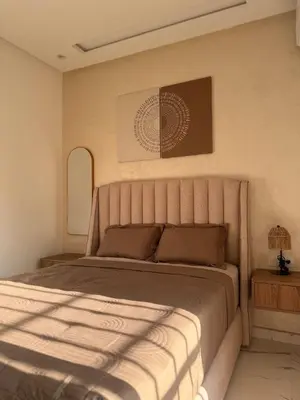 a bedroom with a large bed in a room at Cozy Apartment 5 min From The City Center in Fès