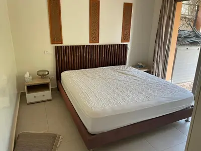 a bedroom with a bed in a room at Olead in Aghmat