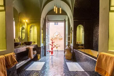 a bathroom with two sinks and a large mirror at Villa Boccara Marrakech in Chaibate