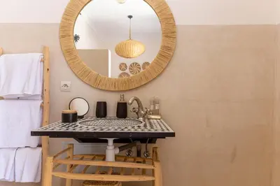 a bathroom with a sink and a mirror at Villa Boccara Marrakech in Chaibate