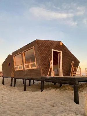 a tiny house on a platform on the beach at La Pointe d'Or Dakhla in Oulad Akkou