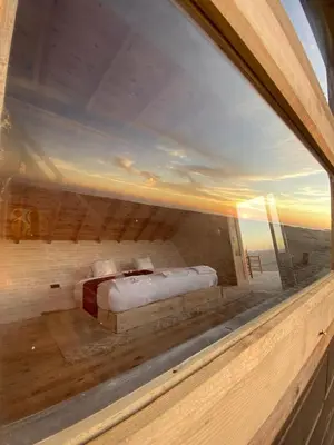 a view of a bedroom through a window at La Pointe d'Or Dakhla in Oulad Akkou
