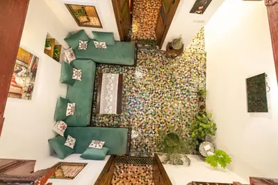 a room with a wall covered in colorful tiles at Dar El Kendil in Fès