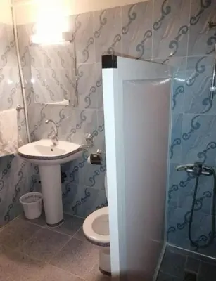 a bathroom with a sink and a toilet at SUD-EST palace in Ait Gmat