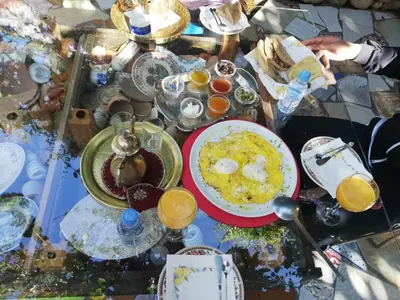 a table topped with plates of food and drinks at Maison d'hotes Ait Bou Izryane in Timoulilt