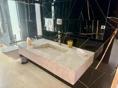 a bathroom with a large marble sink and a toilet at Villa de luxe à louer à la journée A Marrakech in Marrakech