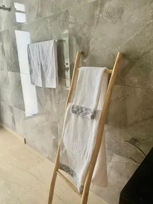 a towel rack in a bathroom with a shower at Villa de luxe à louer à la journée A Marrakech in Marrakech