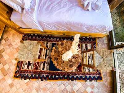 an overhead view of a bed with a comforter at Dar Bikouch in Aït Ben Haddou