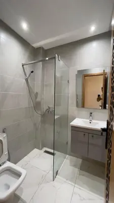 a bathroom with a shower and a sink at luxury Apartments Complete Building in Fez in Douar Trhaïtia