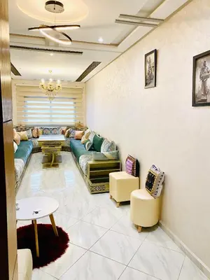 a living room with a couch and a table at New dream home in Fès