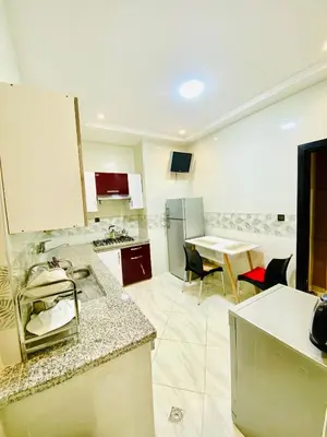 a kitchen with a table and a counter top at New dream home in Fès