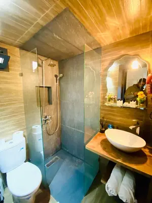 a bathroom with a toilet and a sink and a shower at New dream home in Fès