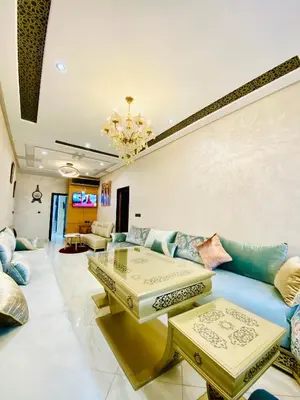 a living room with a couch and a table at New dream home in Fès