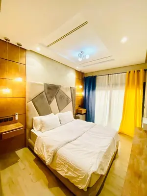 a bedroom with a large white bed in a room at New dream home in Fès