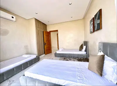 a bedroom with two beds in a room at Villa shams Marrakech , Private Pool and Hammam in Azib Oulad Lâdem