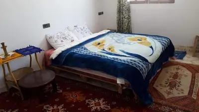 a bedroom with a bed with yellow ducks on it at Auberge chez hammadi