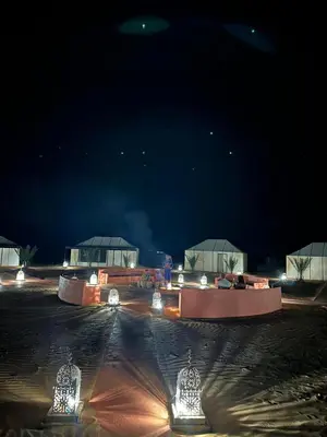 a group of lights in a parking lot at night at Connect Nomad - Luxury Camp Merzouga in Merzouga