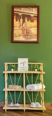 a shelf with two signs and a picture on a wall at Green Ourika Haven Relax Among Mountains Nature