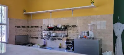 a kitchen with a refrigerator and a counter top at Green Ourika Haven Relax Among Mountains Nature