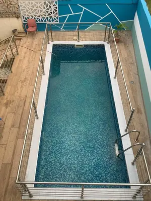an overhead view of an empty swimming pool at la bella cita fes in Fès