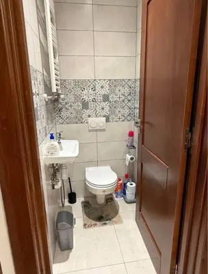 a small bathroom with a toilet and a sink at la bella cita fes in Fès