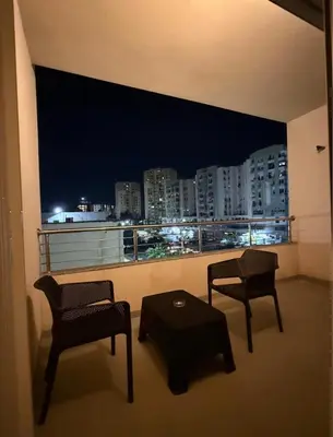 a room with two chairs and a table and a window at la bella cita fes in Fès
