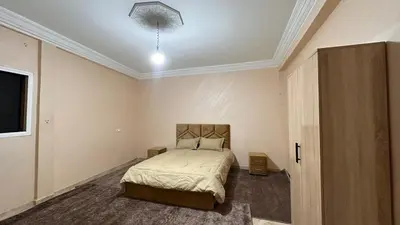 a bedroom with a bed and a ceiling at Appartement centre errachidia in Er Rachidia