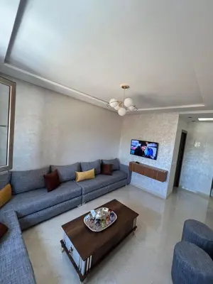 a living room with a couch and a table at Résidence Saadia, Khouribga in Khouribga