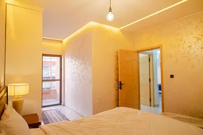 a bedroom with a bed and a window at URBAN WHITE Elya 1 in Beni Mellal