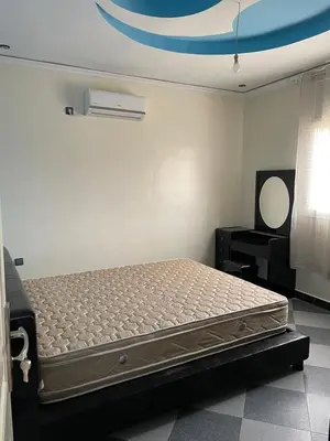 a bedroom with a bed in a room with a ceiling at Villa HMR ⵥ in El Ksiba
