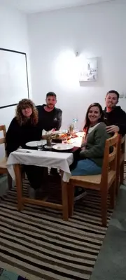 a group of people sitting around a table at Riad La Belle Vue in Boumalne