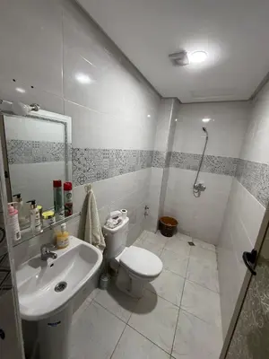 a bathroom with a toilet and a sink at Kamlia meknes in Meknès