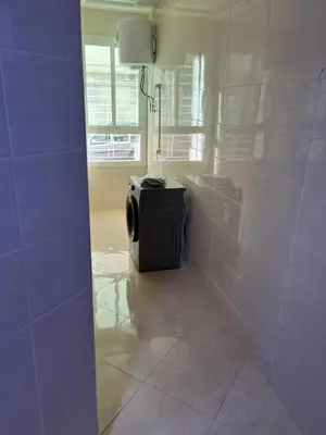 a bathroom with a toilet in the corner of a room at appartement fes in Fès