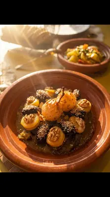 a bowl of food with shrimp on a table at villa lalla Ourika & heated pool in Oulad Akkou