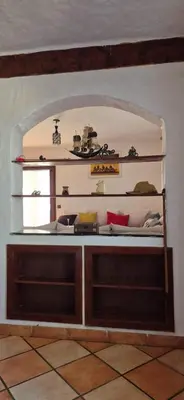 a room with two shelves and a sink at Chez Nour in Oulad Akkou