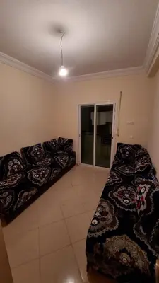 a bedroom with two beds and a window at New apartment fully equipped in Fès
