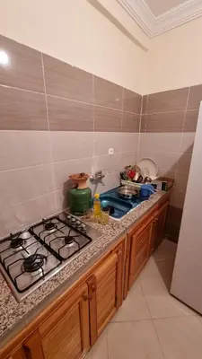 a kitchen with a stove and a counter top at New apartment fully equipped in Fès