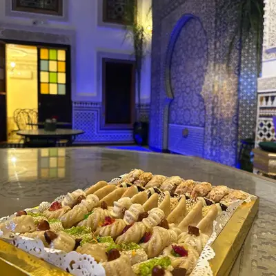 a bunch of food on a table in a room at Riad Dar ElBellar in Fès