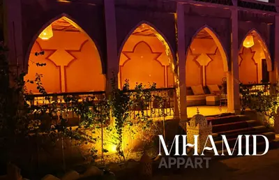 a night view of a mosque at a wedding at mhamid hotel in Kasr Bounou
