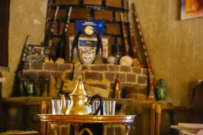 a tea kettle on a table in a room at Auberge Palacio Sidi Hamza in Tazrouft