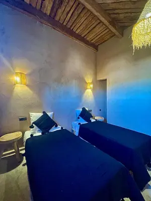 two beds in a room with blue sheets at Dar Zitoune - Authentic Stay in Tagounite in Tagounite
