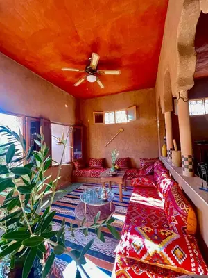 a living room with a couch and a ceiling at Dar Zitoune - Authentic Stay in Tagounite in Tagounite