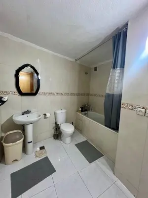 a bathroom with a sink and a toilet and a tub at Large 3 Bedrooms Medina center Parking Secure in Fès