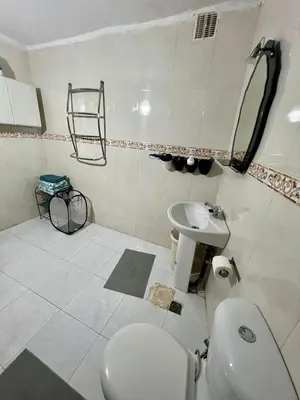 a bathroom with a toilet and a sink at Large 3 Bedrooms Medina center Parking Secure in Fès